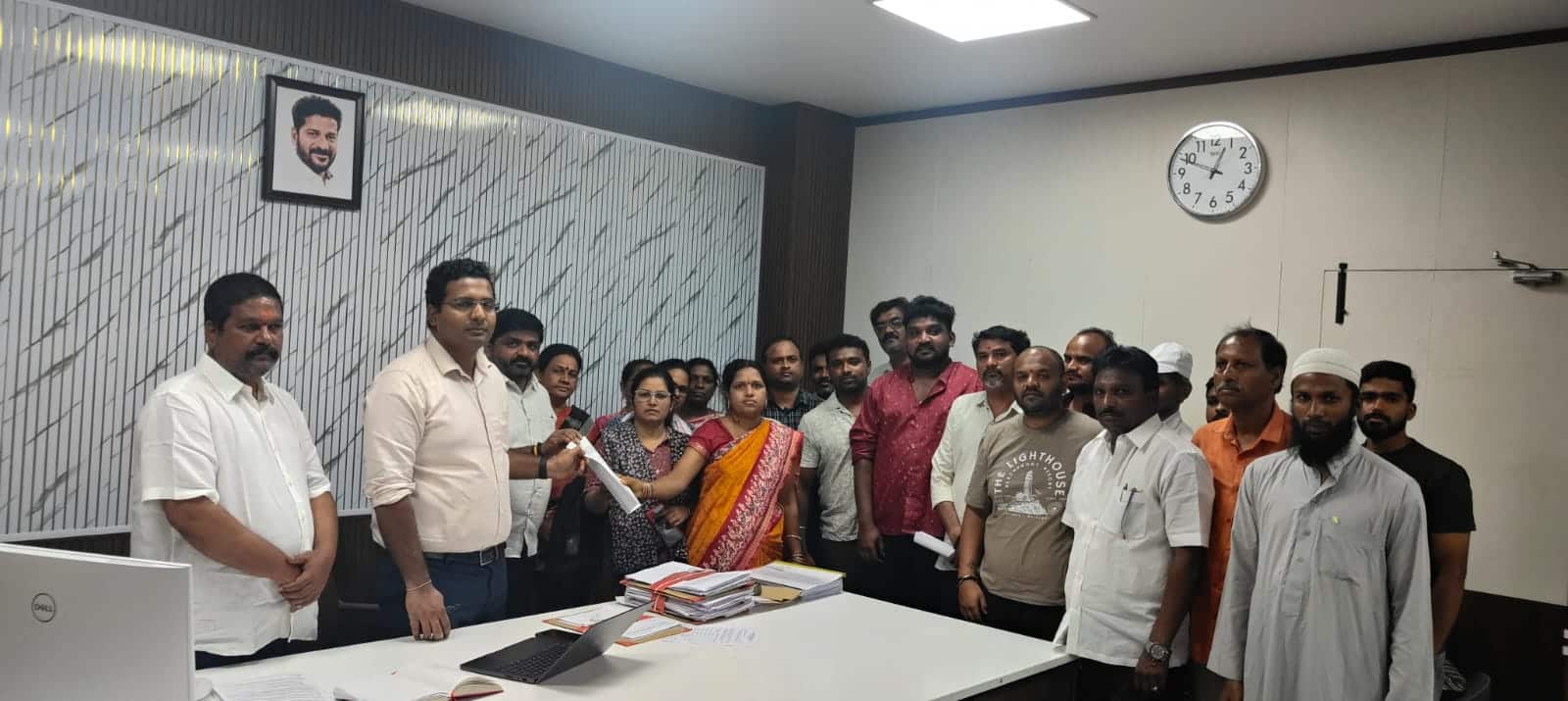 Geedi Charanjith Goud with residents submitting petition against illegal cell tower in SP Nagar